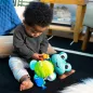  BABY EINSTEIN Aktív játék C-karikán teknős Neptune’s Sensory Sidekick™ 0hó+