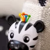 BABY EINSTEIN Rágóka csörgővel zebra Zen™ Shake-a-Shape BPA mentes 0hó+